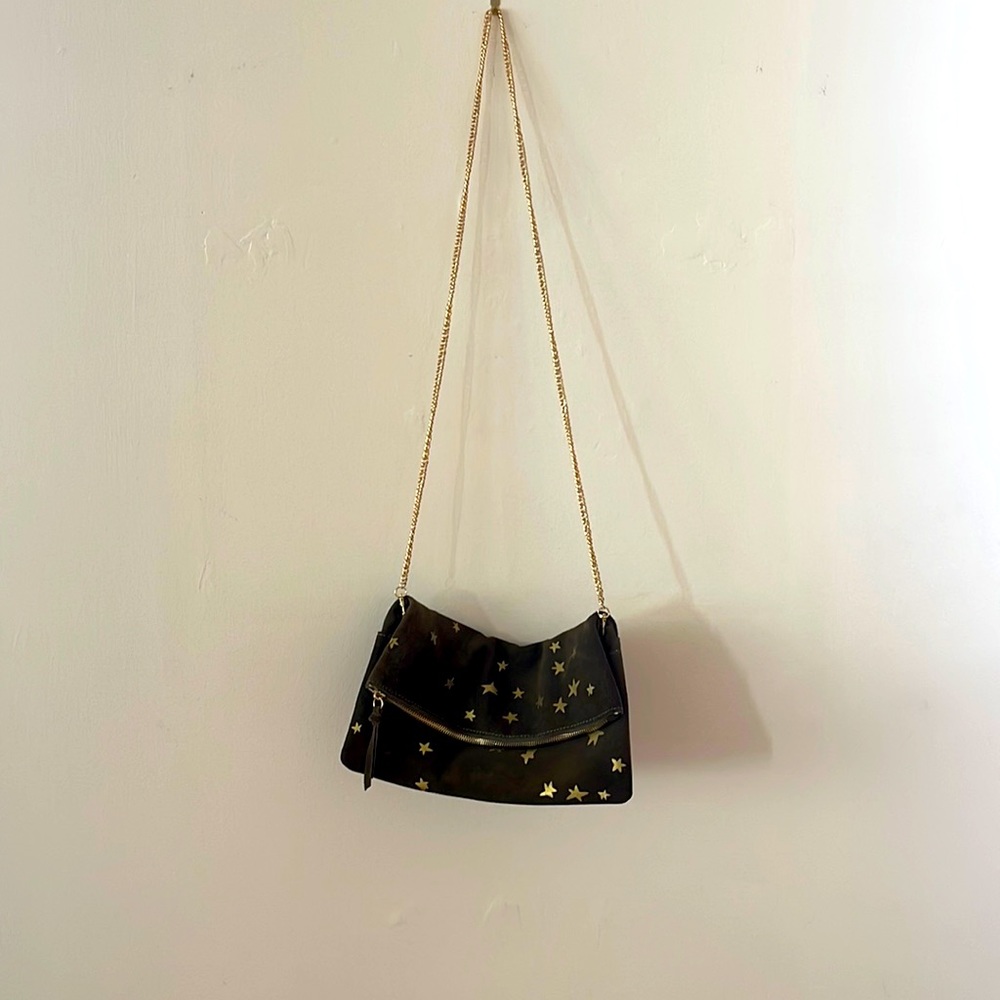 Moda Luxe Brown suede convertible clutch with gold stars and gold chain strap.